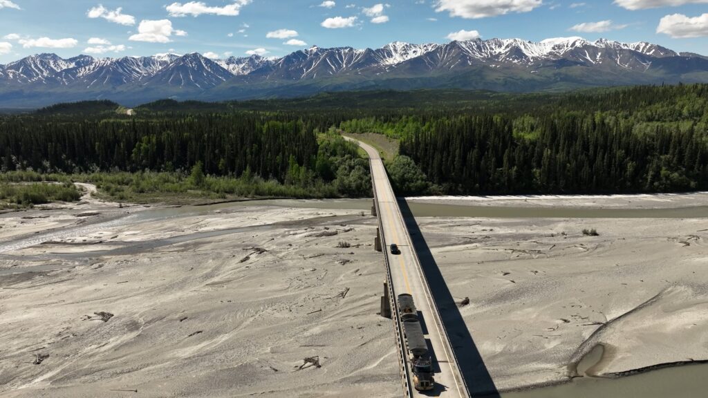 Photo of b train hauling ore across a bridge