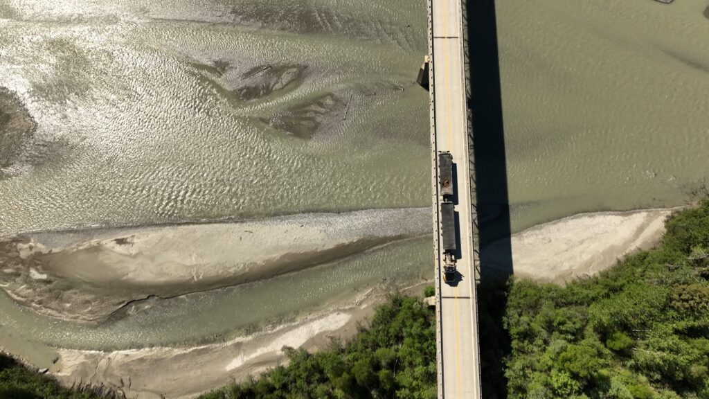 Photo of b train hauling ore across a bridge